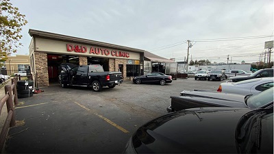 outside of D & D Auto Clinic, an auto service shop in Massapequa, New York that provides oil changes